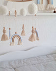 Mobile "Soft Blue" with three rainbows, pom-poms, and tassels