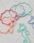Motifs sous-marins en tricot tubulaire – coquillages et hippocampes