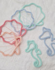 Motifs sous-marins en tricot tubulaire – coquillages et hippocampes