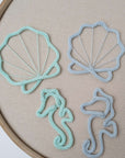 Motifs sous-marins en tricot tubulaire – coquillages et hippocampes