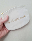 Small toiletry bag with gold lettering