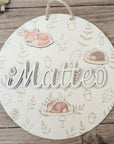 Desired colors: Wooden sign with rainbow and plotted name